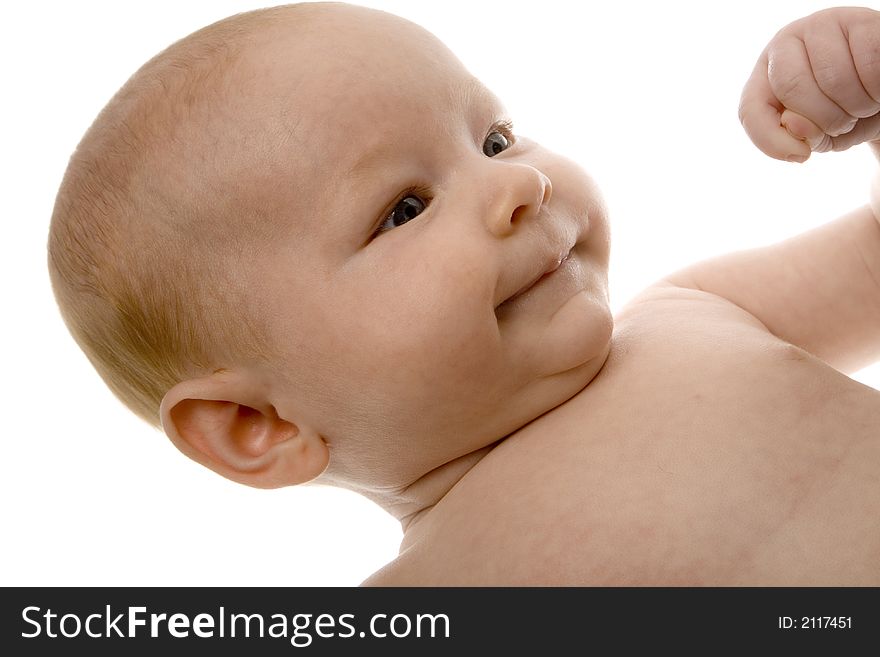Newborn smiling with fist