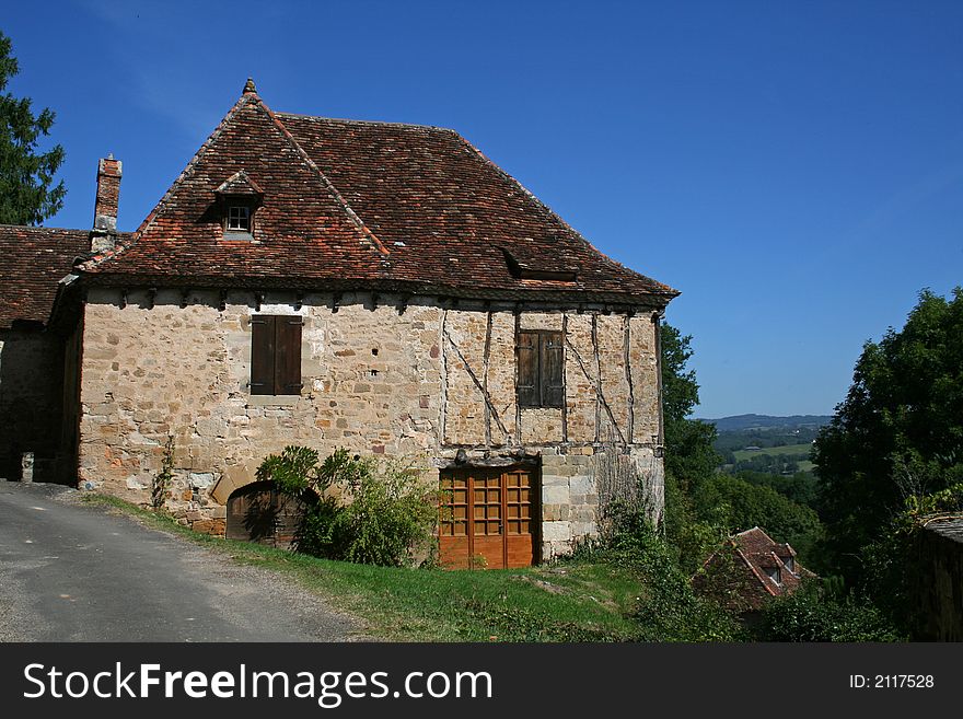 Old barn on side of road, overlooking the scenery. Old barn on side of road, overlooking the scenery