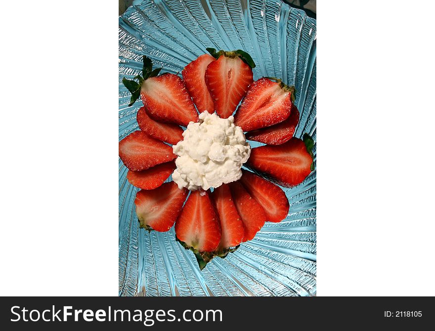 Strawberries and cottage cheese on a glass plate