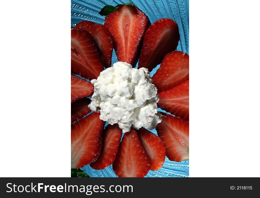 Close-up image of strawberries and cottage cheese on plate. Close-up image of strawberries and cottage cheese on plate