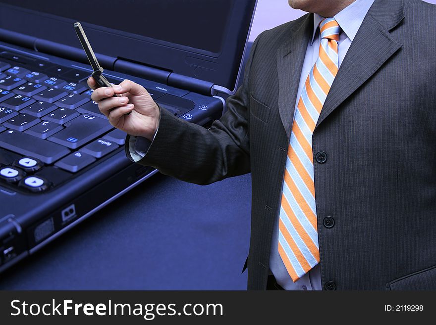 Businessman interacting with his laptop. Businessman interacting with his laptop