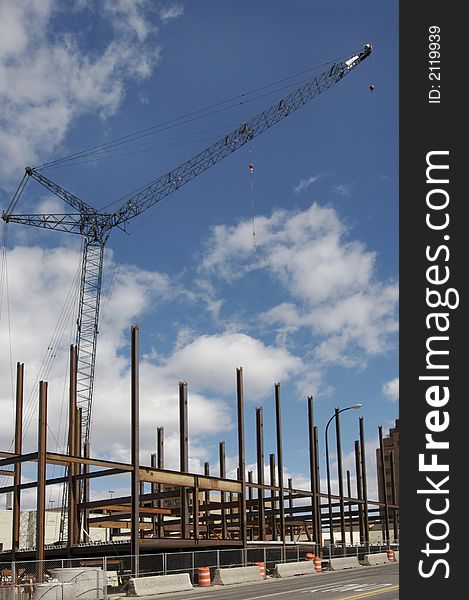 Construction crane and building girders against blue sky. Construction crane and building girders against blue sky