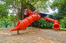 Red Colorful Slide Treehouse Garden Play Area Stock Photo