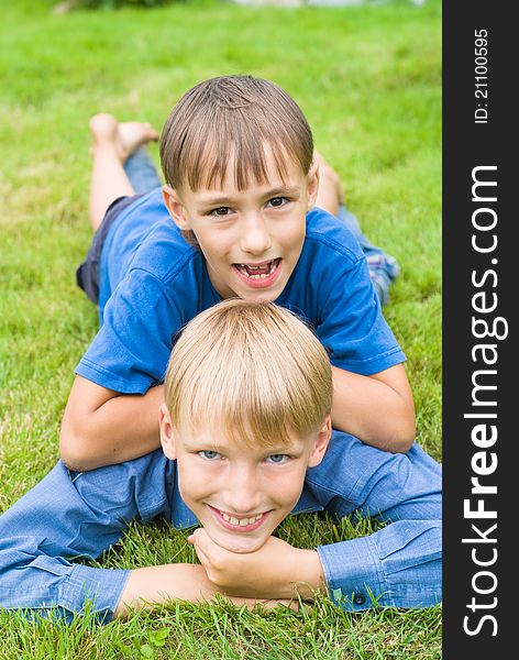 Portrait of a two bros on grass