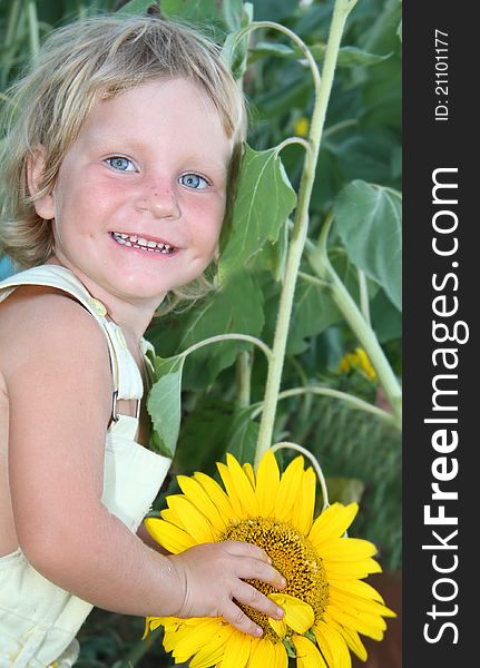 Toddler Girl With Sunflower Outdoor