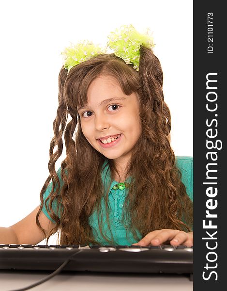 Cute little girl with a computer on white. Cute little girl with a computer on white