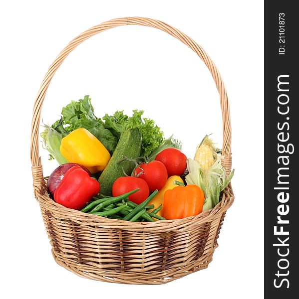 Basket of vegetables isolated on a white background. Basket of vegetables isolated on a white background