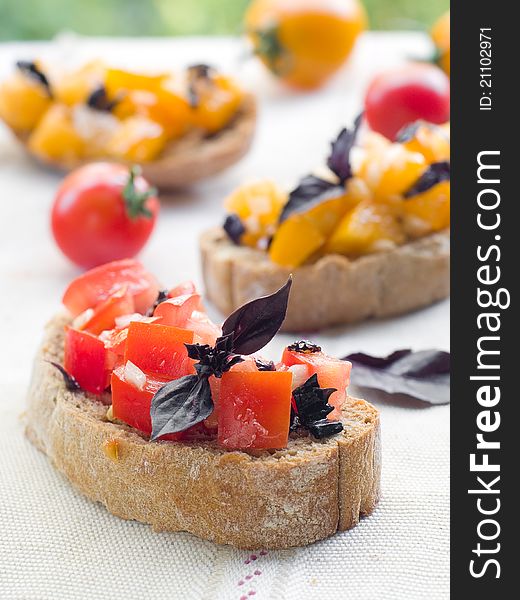 Bruschetta  with tomato, onions and freshly chopped basil, selective focus