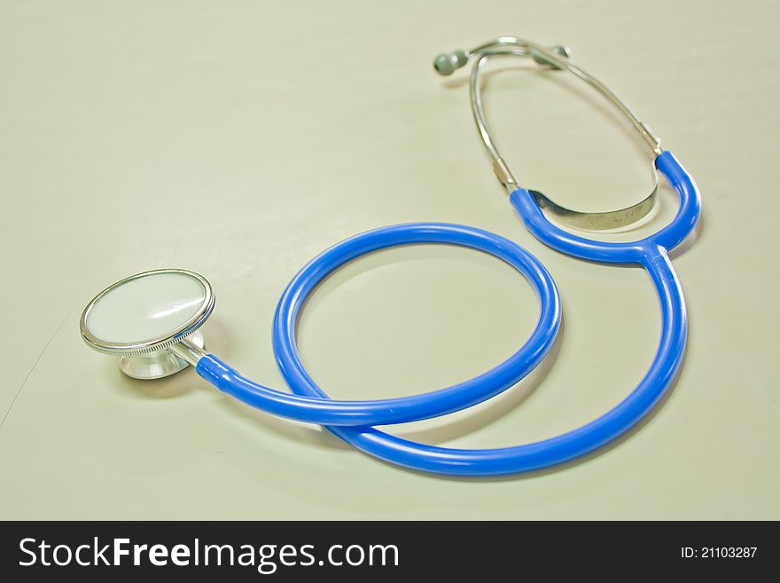 Blue color stethoscope on the table. Blue color stethoscope on the table