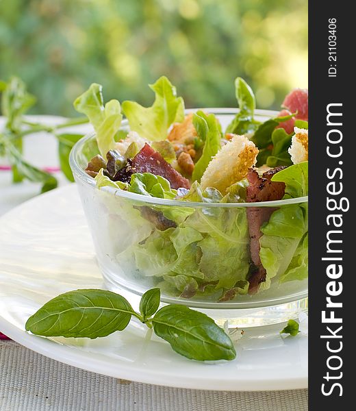 Fresh salad from lettuce, croutons and bacon. Selective focus. Fresh salad from lettuce, croutons and bacon. Selective focus