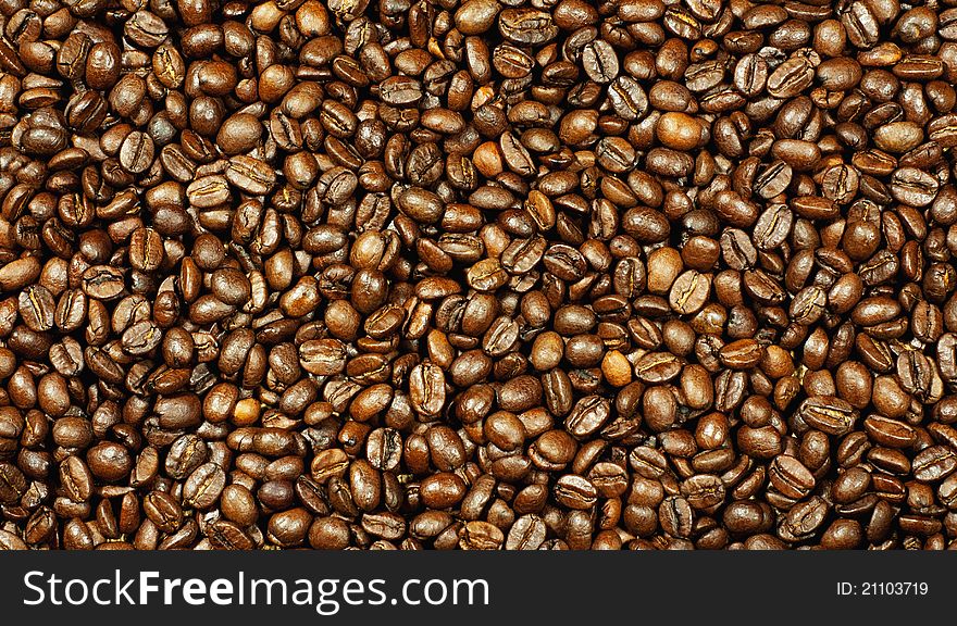 Background of coffee beans. Texture, close-up