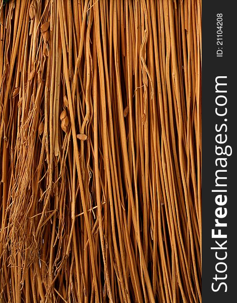 A closeup vertical image of tan broom material. A closeup vertical image of tan broom material.
