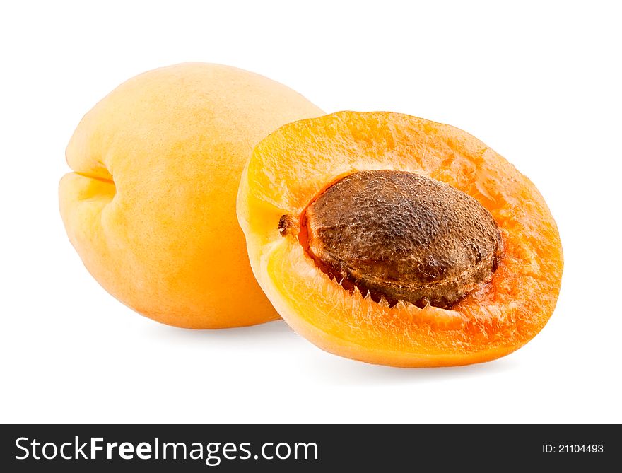 Apricot and half with bone on white background