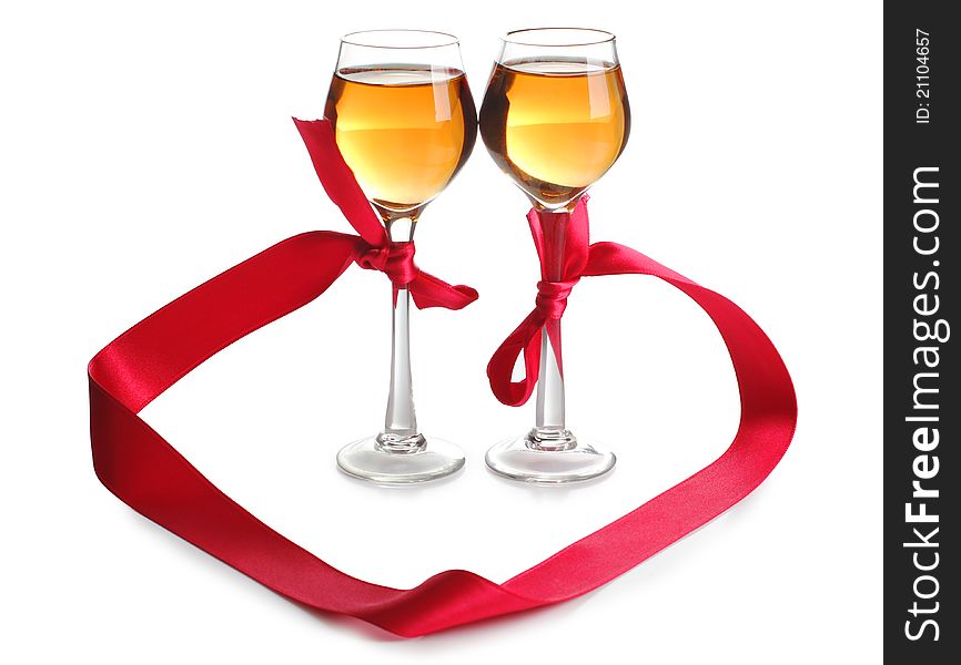 Color photo of wine glasses and a red ribbon. Color photo of wine glasses and a red ribbon