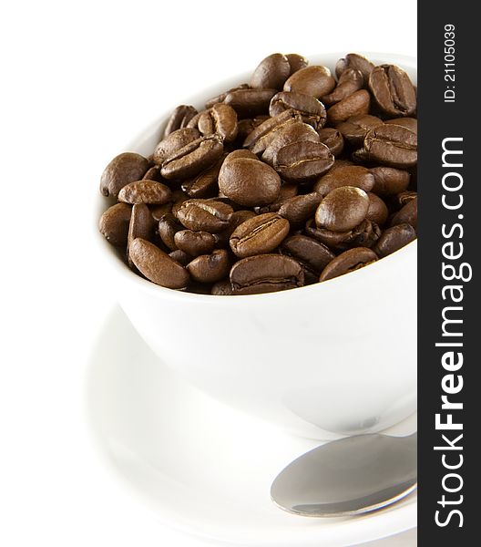 Cup of coffee and beans on white background