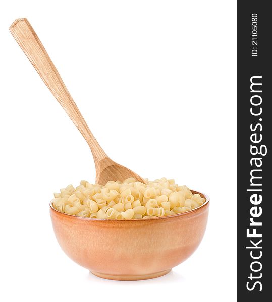 Raw pasta and wooden spoon on white background