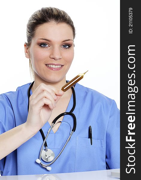 Woman doctor looks at an ampoule with a medicine