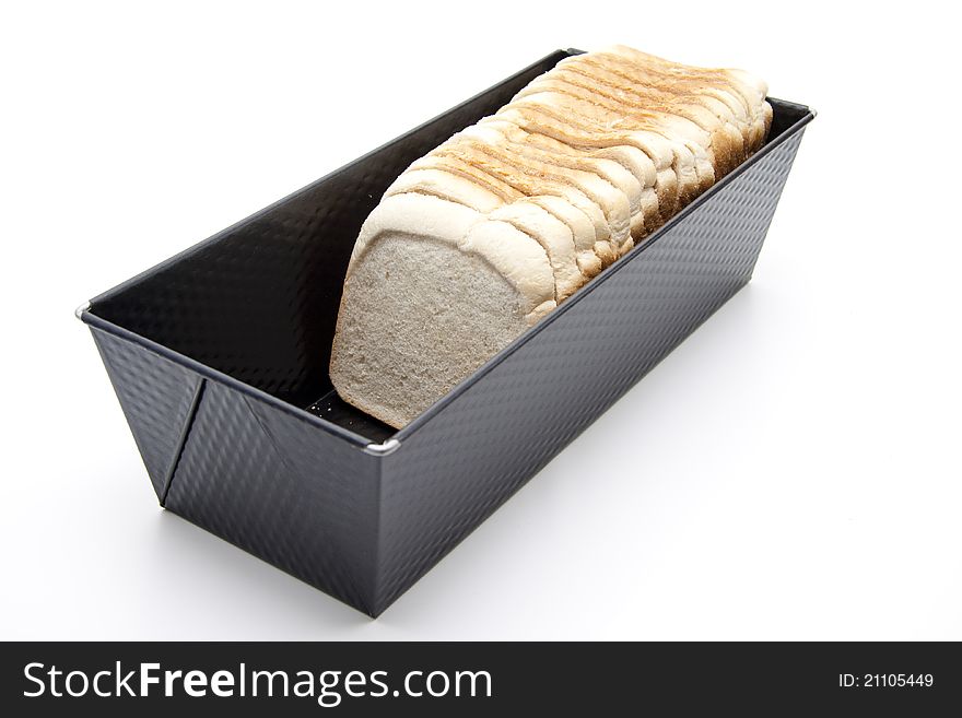 Bread baking tin with white bread
