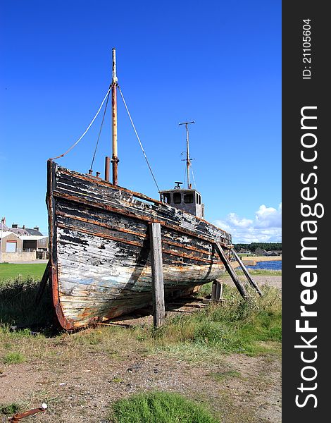 Old boat at Burghead harbour, Moray, Scotland