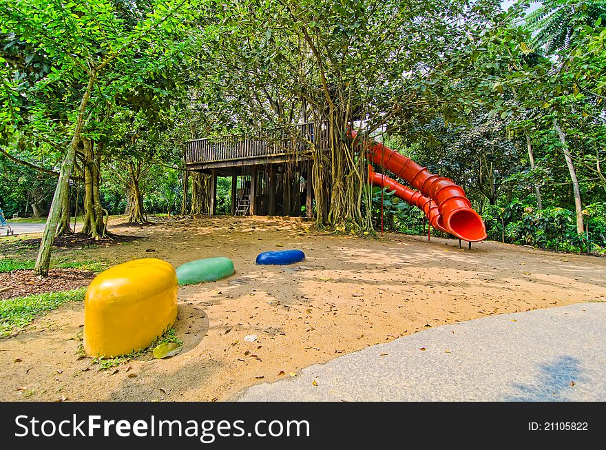 Red colorful slide treehouse garden play area