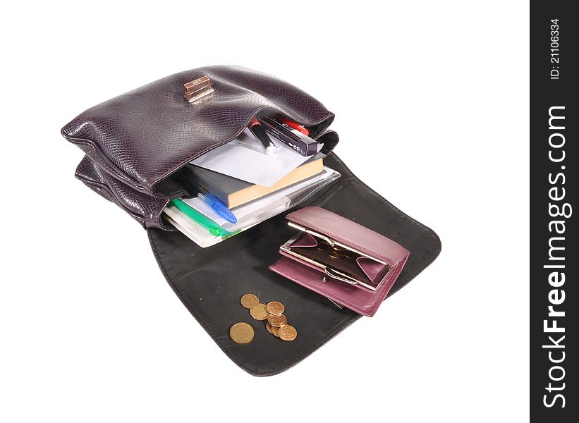 Notebooks, handles, books, writing-books, a purse, money are laid out from a bag. Notebooks, handles, books, writing-books, a purse, money are laid out from a bag