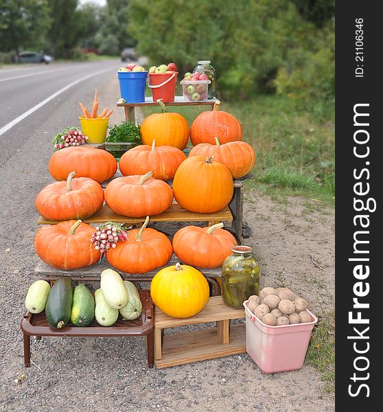 Vegetables are laid out at a highway for sale. Vegetables are laid out at a highway for sale
