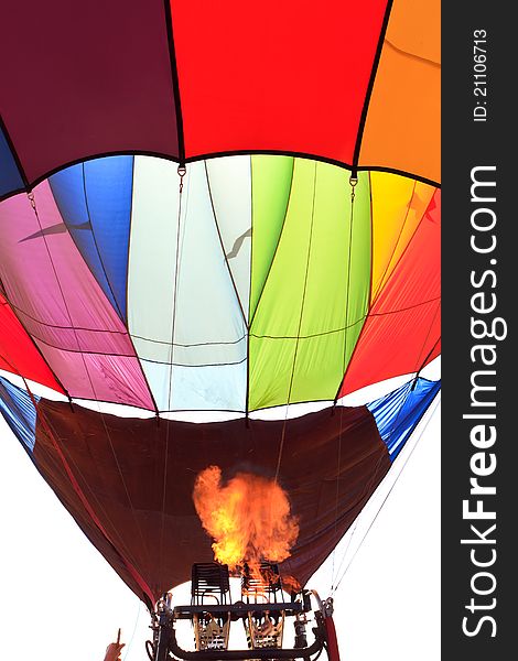 Colorful hot air balloon with flame