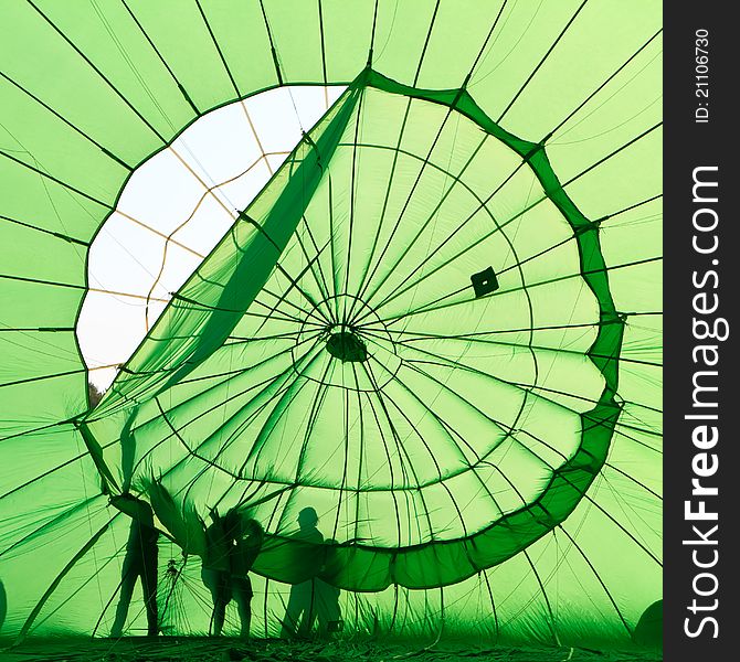 People fixing hot air balloon