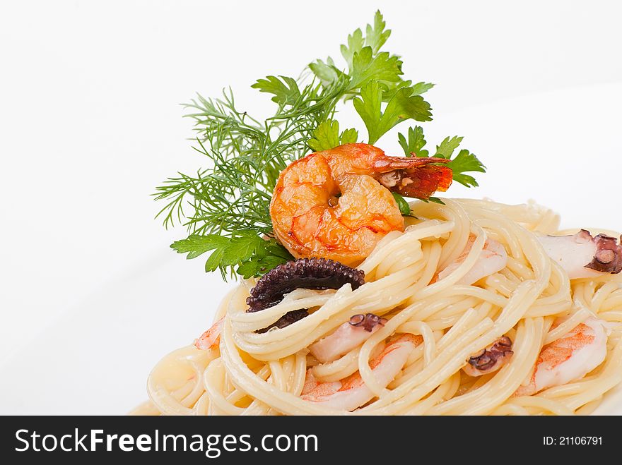 Italian closeup of spaghetti with seafood and cheese creamy sauce