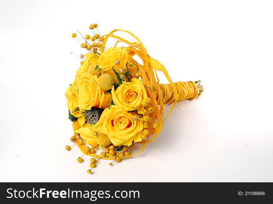 Yellow bridal bouquet with roses and lotus fruits