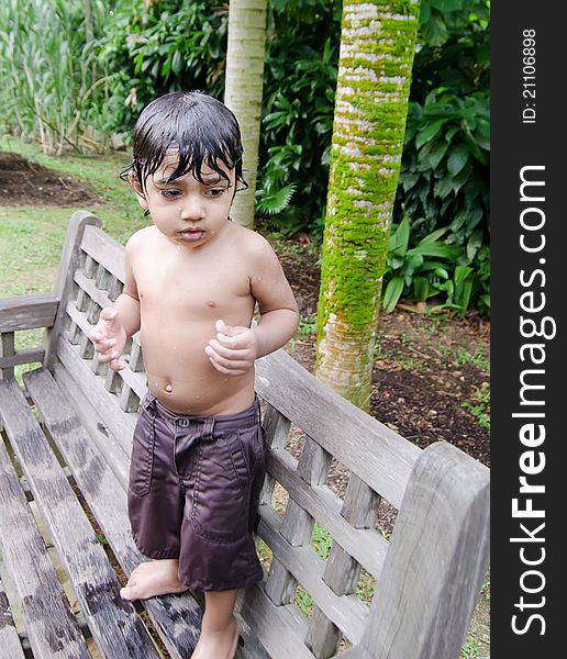 Wet Toddler Boy Standing After Playing With Water