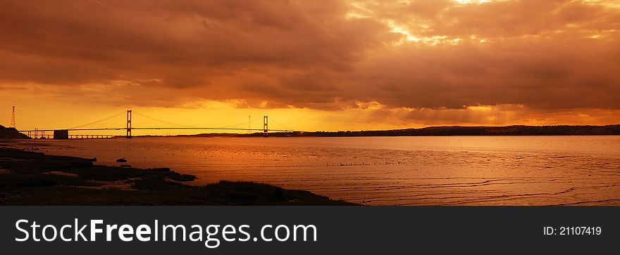 Sunset over the River and Bridge