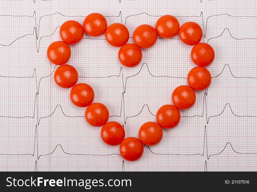 Heart  of pills on electrocardiogram. Heart  of pills on electrocardiogram