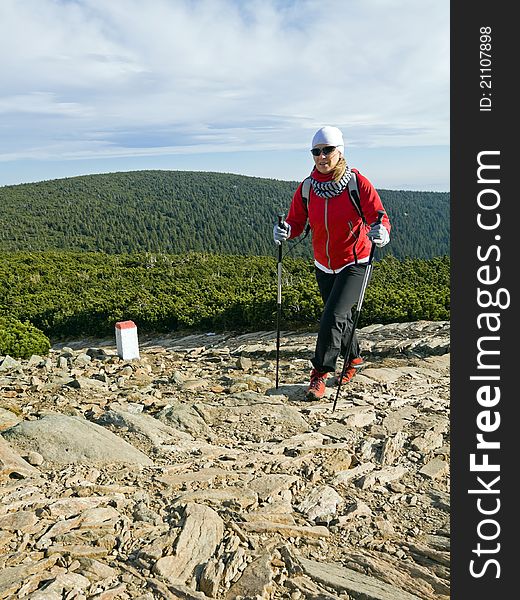 Woman on nordic walking trip in autumn mountains. Woman on nordic walking trip in autumn mountains