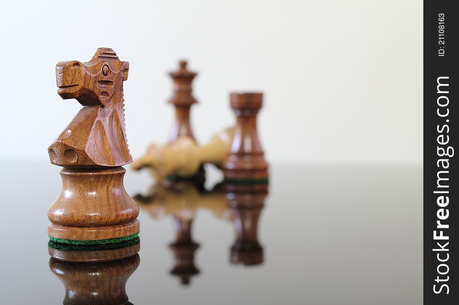 Chess scene on a smoked glass table. Chess scene on a smoked glass table.