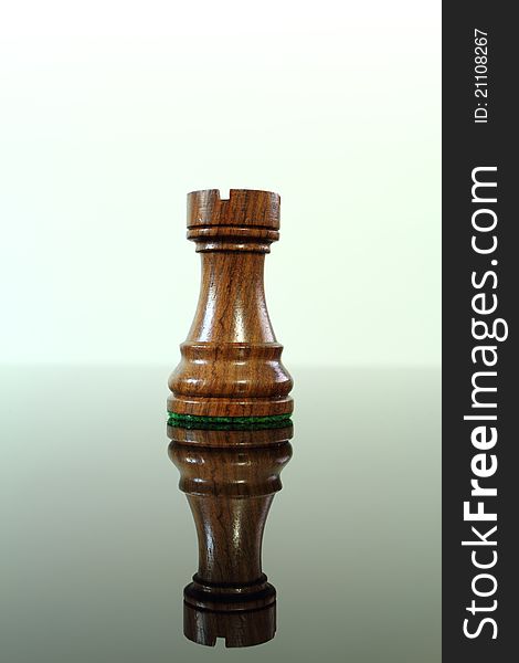 Chess rook or castle on a smoked glass table. Chess rook or castle on a smoked glass table.