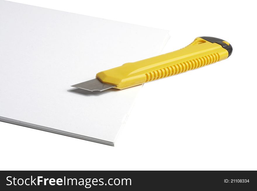 Yellow paper knife and paper stack on white background. Yellow paper knife and paper stack on white background