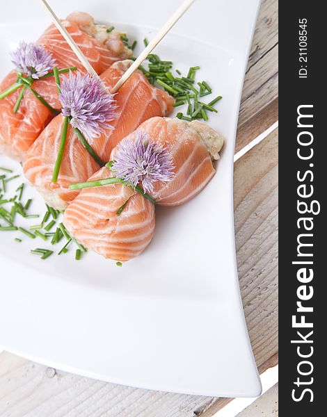 Mediterranean diet, main course, rolls of raw salmon. Mediterranean diet, main course, rolls of raw salmon