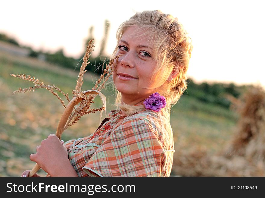 Young Woman In Corn Haystack