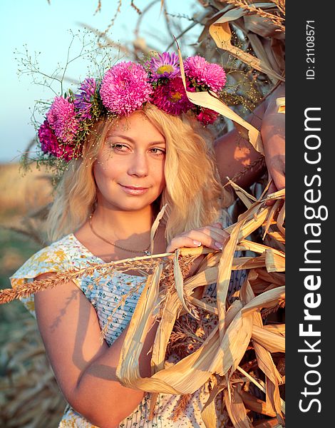 Young woman in corn haystack and sunset. Young woman in corn haystack and sunset