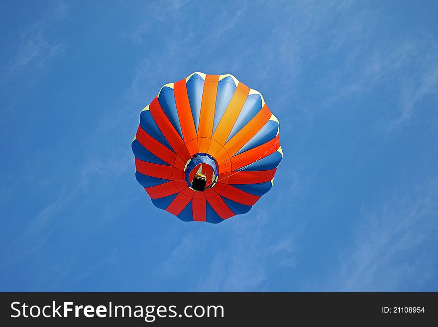 Hot air balloon on light blue background with red blue and yellow highlights. Hot air balloon on light blue background with red blue and yellow highlights.