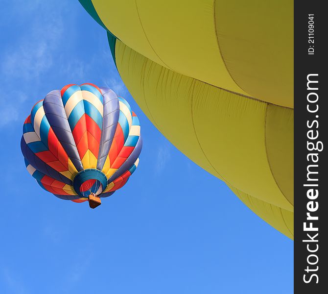 Colorful hot air balloon over blue sky