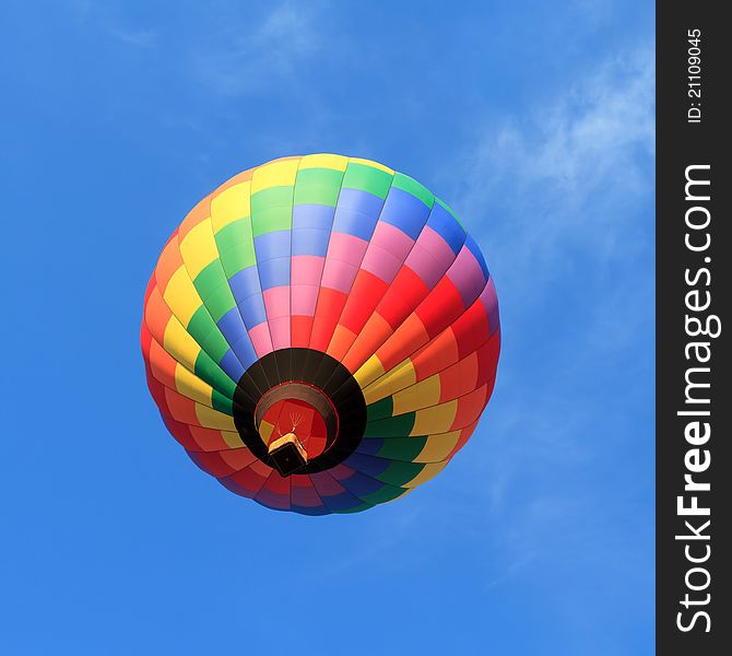 Colorful hot air balloon over blue sky