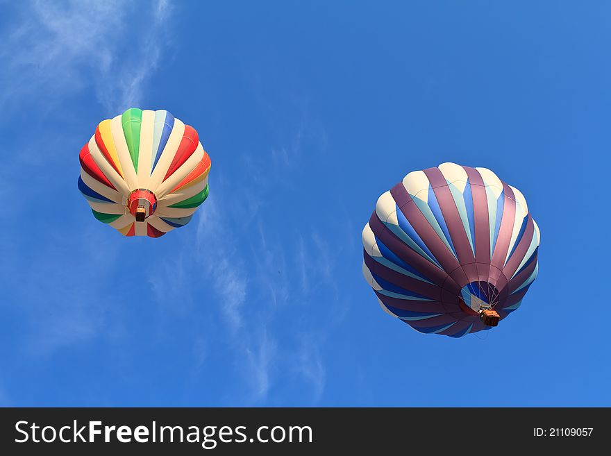 Hot air balloons over blue sky