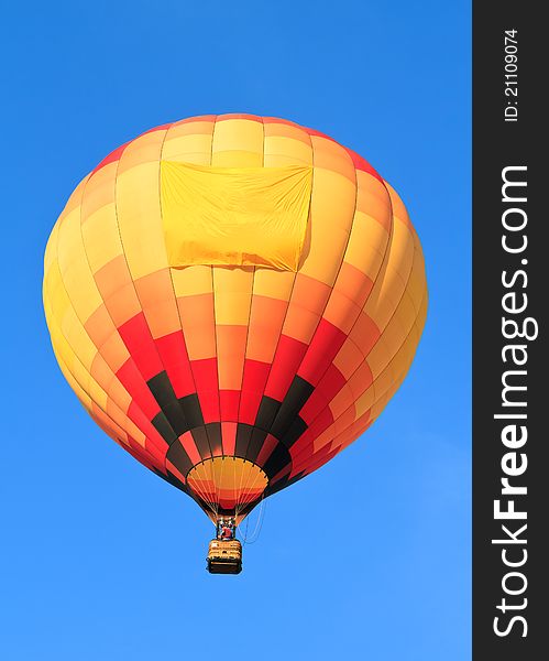 Colorful hot air balloon with empty banner