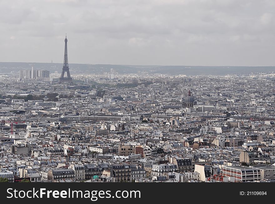 Eiffel Tower from across Parisan rooftops. Eiffel Tower from across Parisan rooftops.