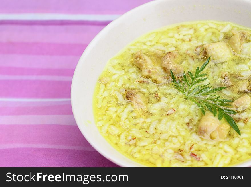 Asian style rice soup with herbs in a bowl