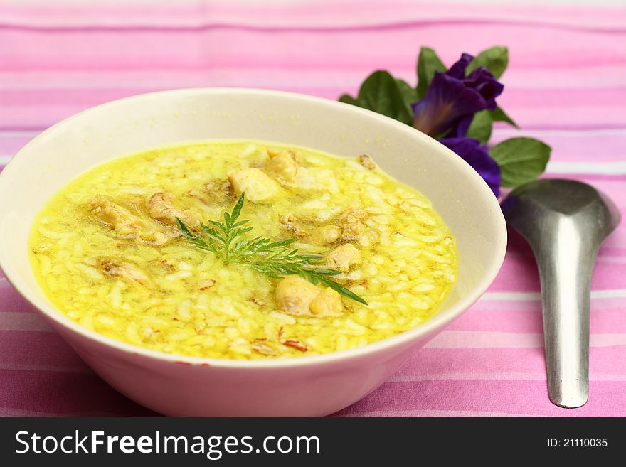 Asian style rice soup with herbs in a bowl
