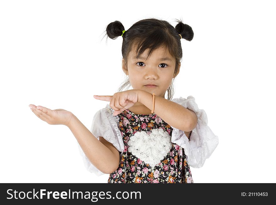 Cute Asian girl pointing at something in her hand, isolated on white background. Cute Asian girl pointing at something in her hand, isolated on white background