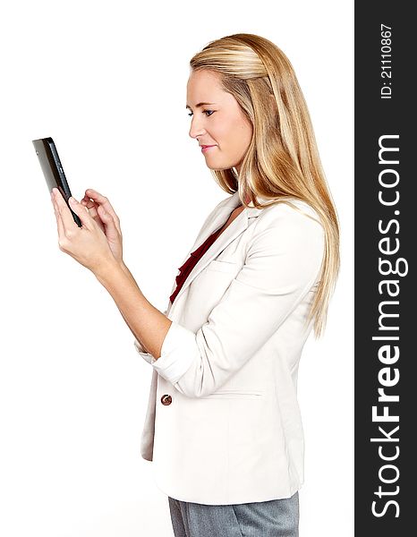 Pretty blond professional woman using her touch screen pad. Pretty blond professional woman using her touch screen pad
